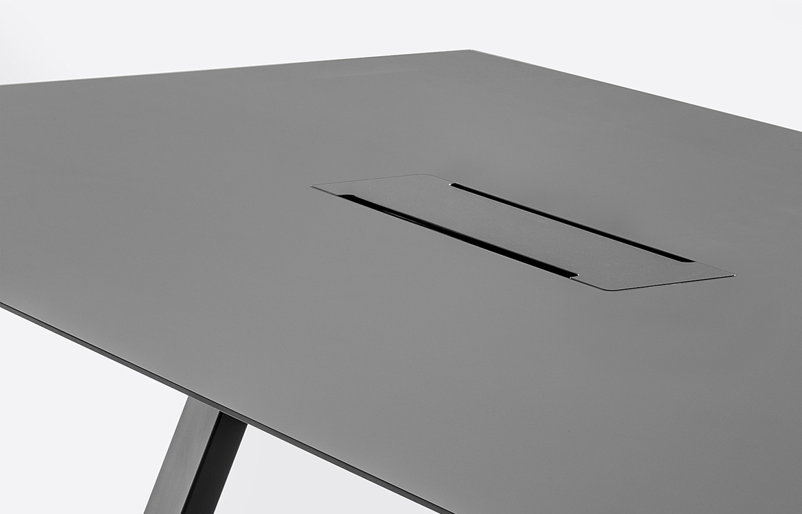 Black commercial table with cable hatch