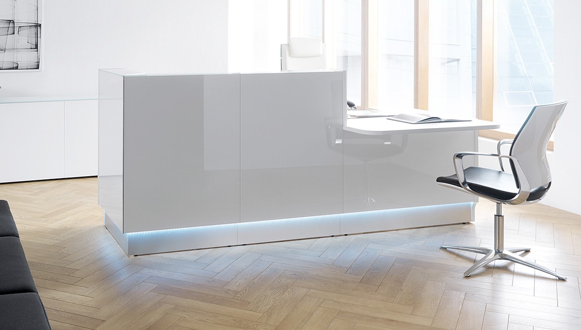 Glass Reception Desk on Wood Floor