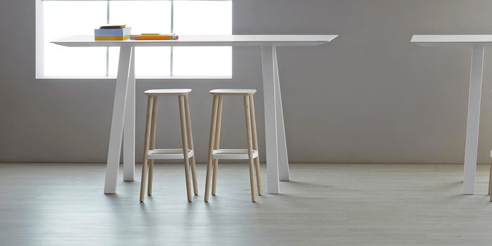 Commercial wood high stool in a light wood