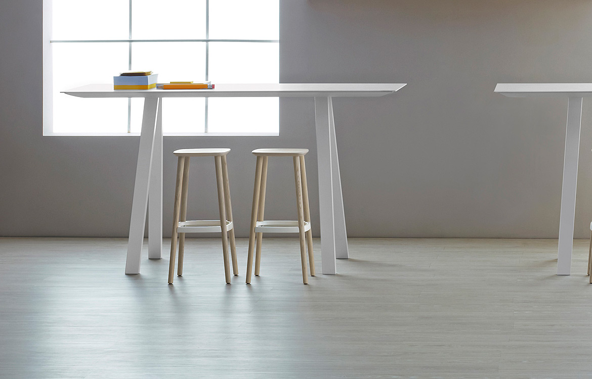 Commercial wood high stool in a light wood