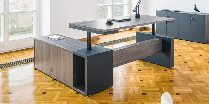 Executive desk with adjustable height top