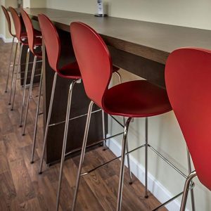 How can high stools and bar stools help canteens to save space?