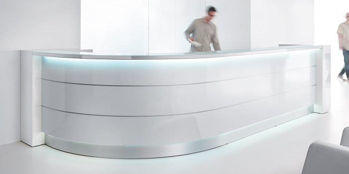 How did the modern curved reception desk come to be?
