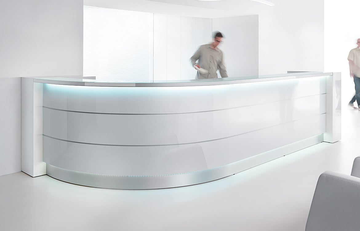 How did the modern curved reception desk come to be?