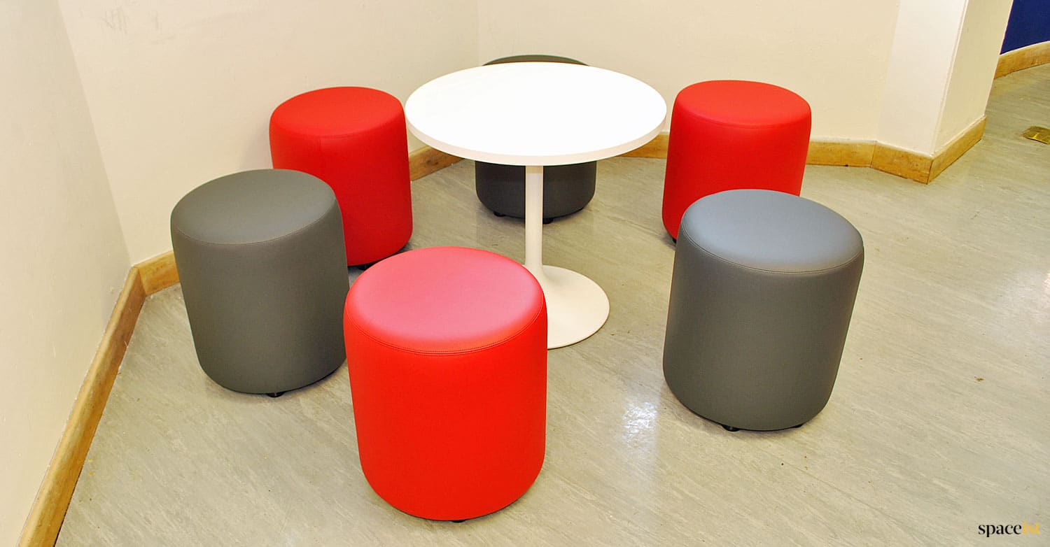 Low padded stools for common room