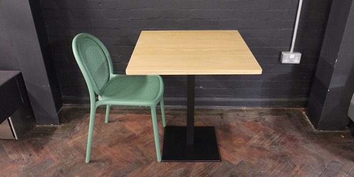 Oak wood table with green chair