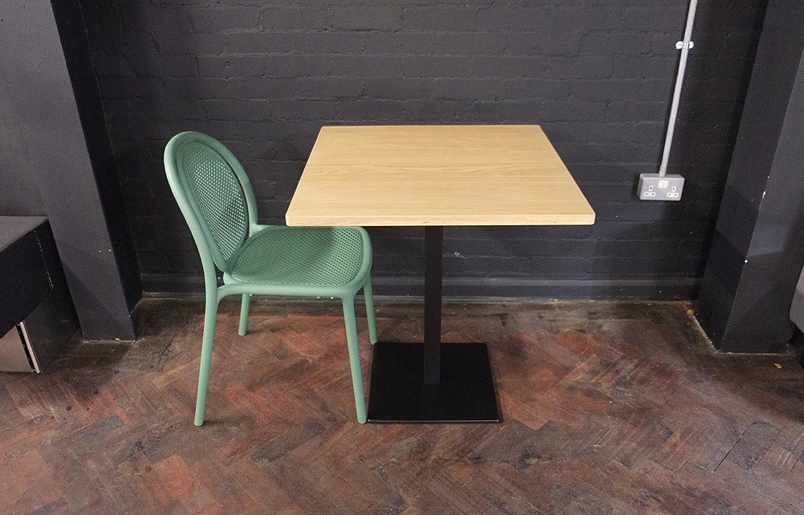 Oak wood table with green chair