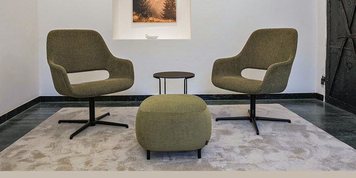 Swivel reception chair in a green fabric