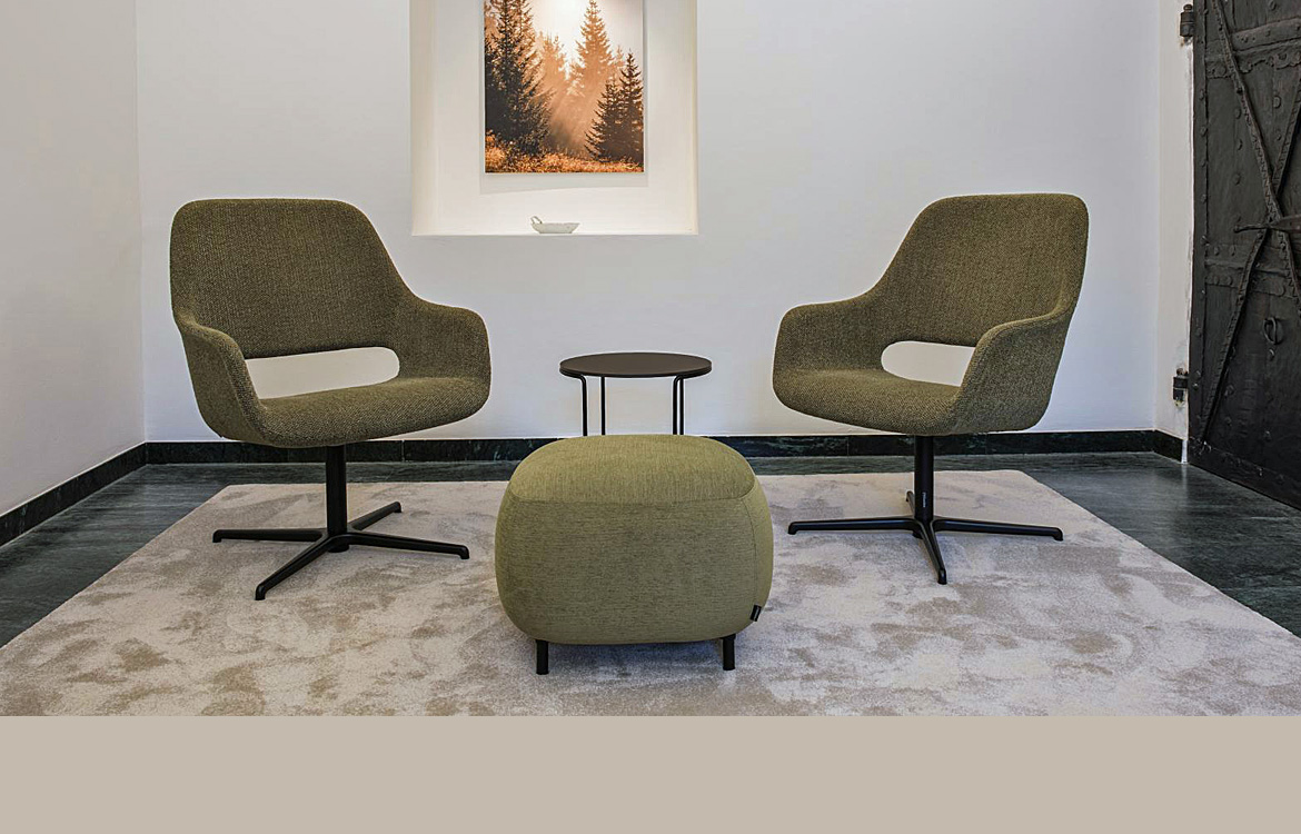 Swivel reception chair in a green fabric