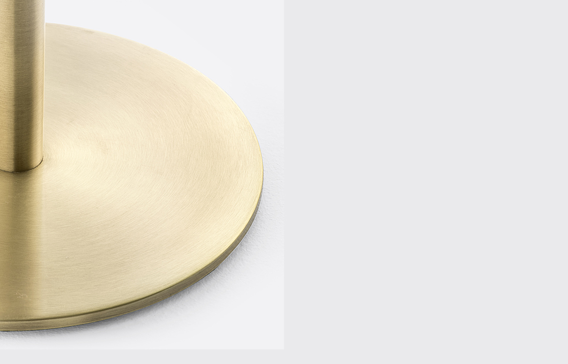 Round brass cafe table closeup