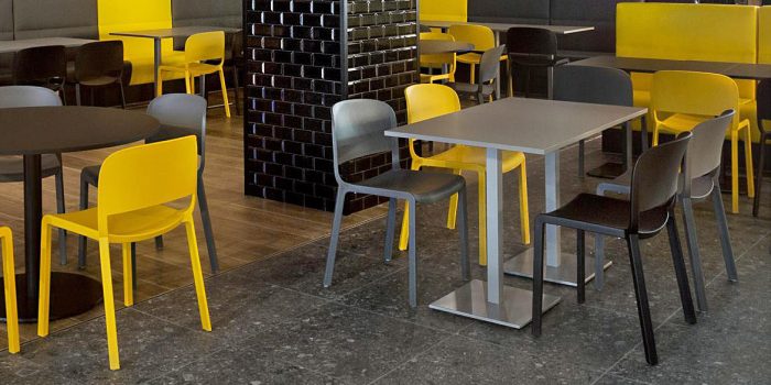 Grey cafe table and plastic chairs