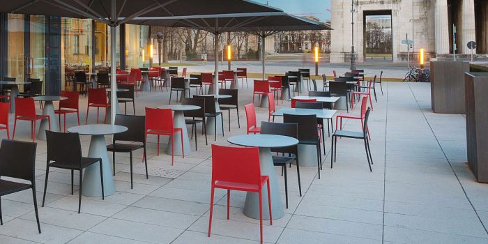 Red outdoor cafe chair with round table