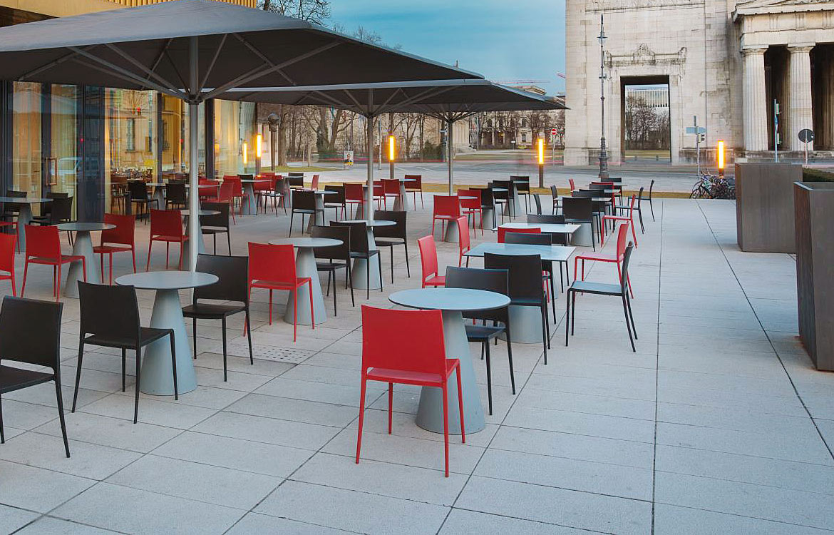 Red outdoor cafe chair with round table