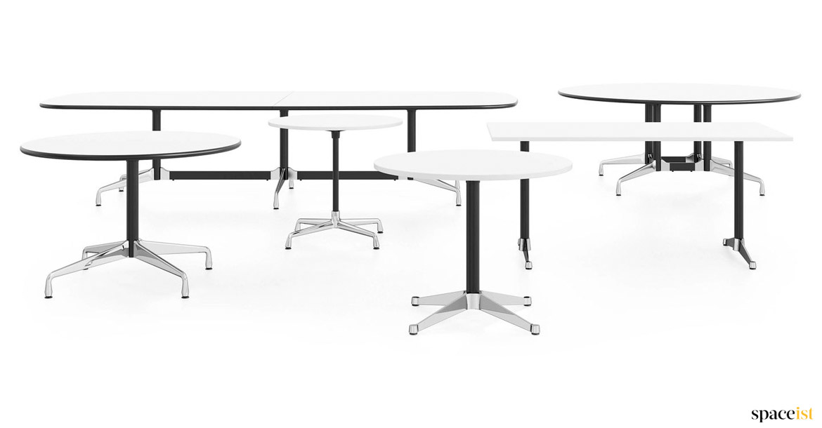 Group of oval and round white meeting tables
