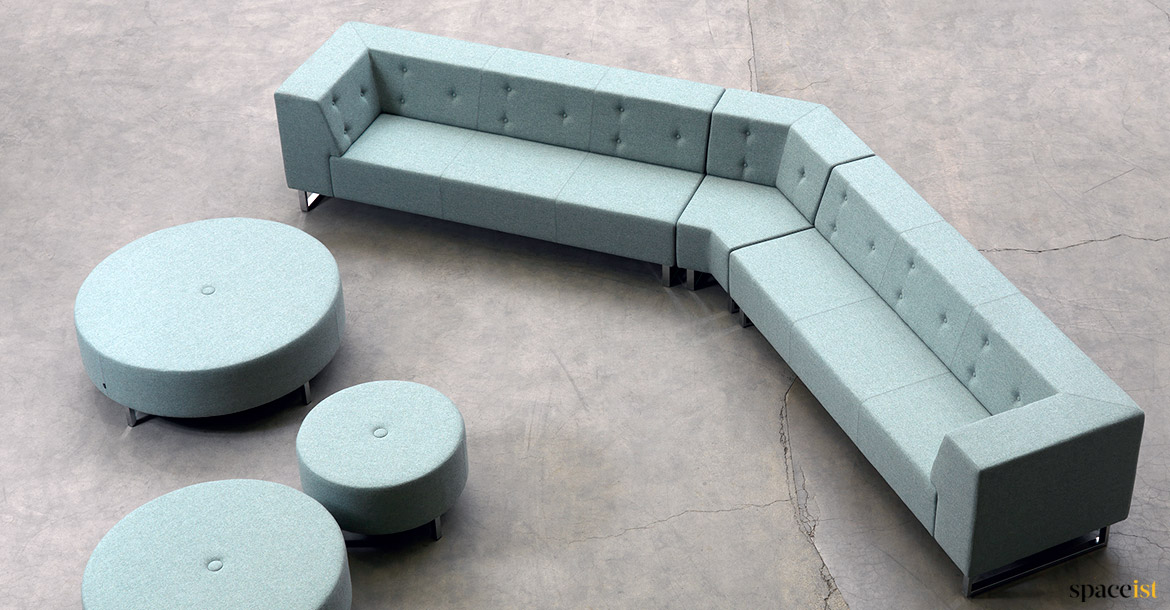 Angles sofa with large round stools