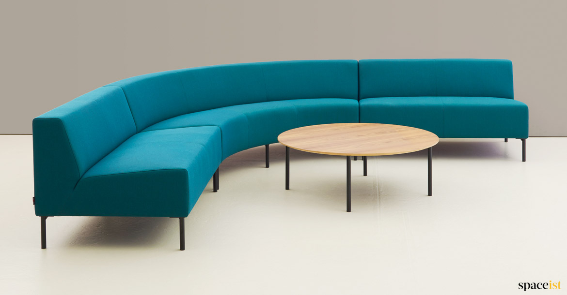 Blue corner sofa with curved seat