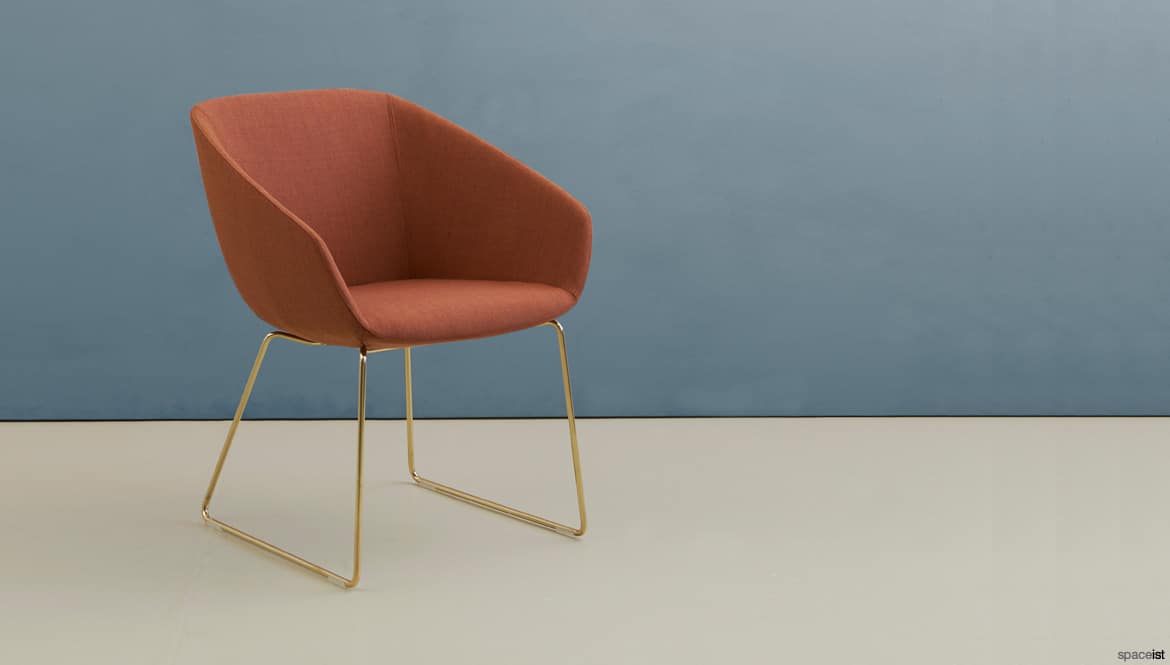 Tub chair with a brass leg