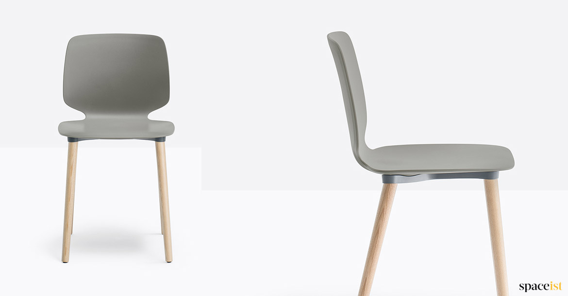Grey plastic chair with a wood leg