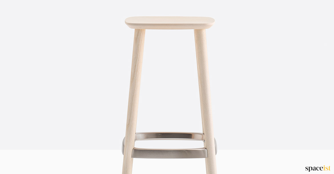 Wood stool with brass foot rest