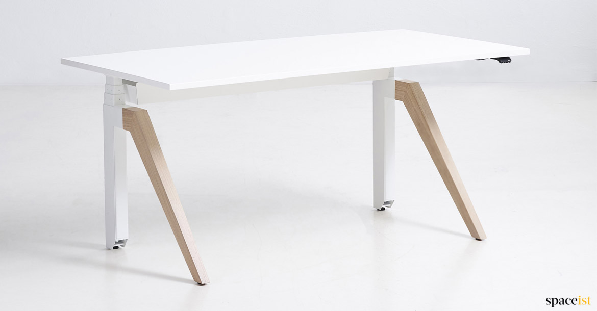 Adjustable desk with a solid oak leg
