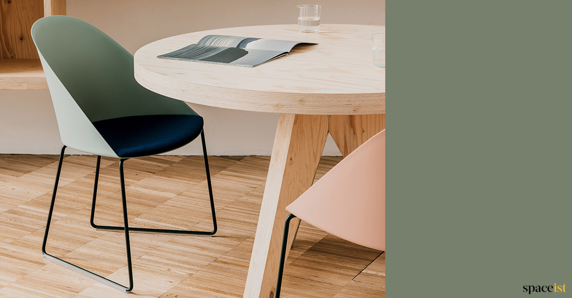 Sage green chair with plywood table