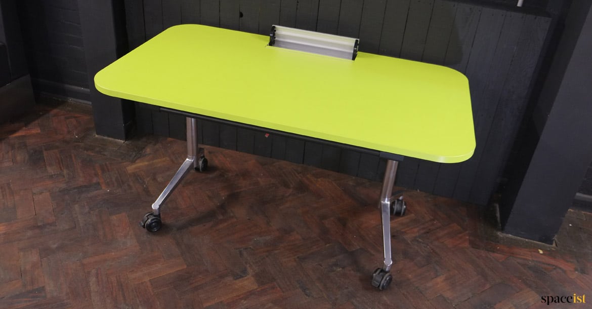 Green table with cable hatch sockets