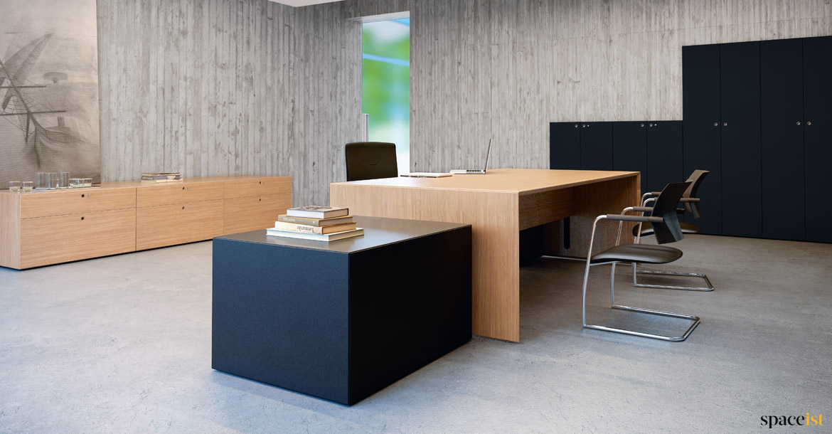 Office with large oak desk + black storage