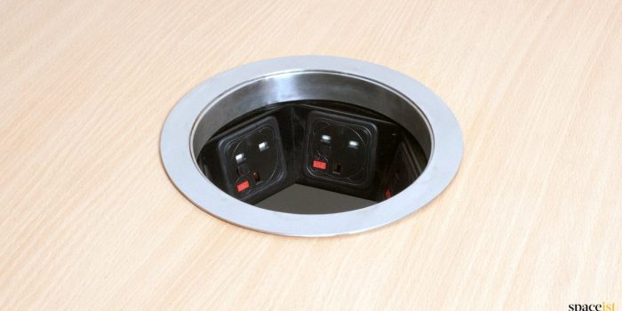 Large round grommet with plug sockets