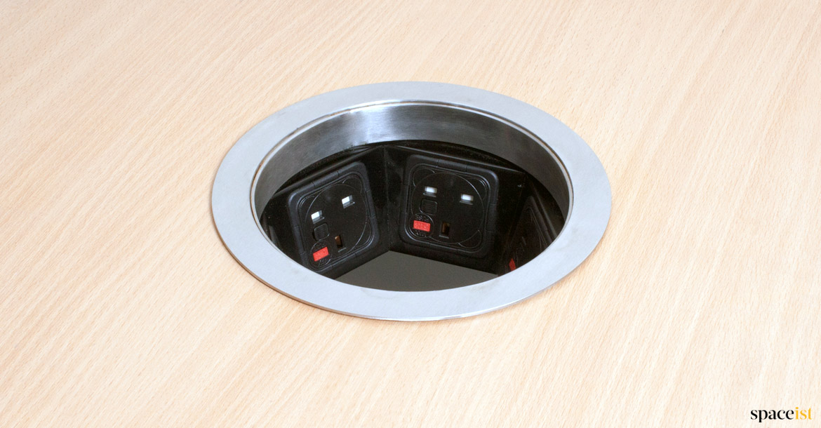 Large round grommet with plug sockets