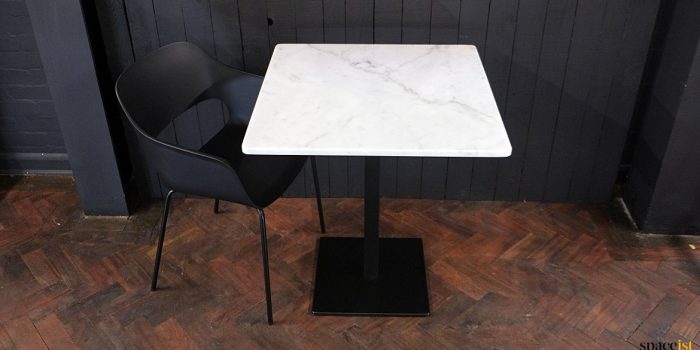 White marble top with black chair