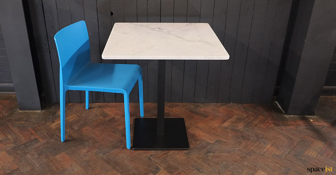 MArble table blue chair