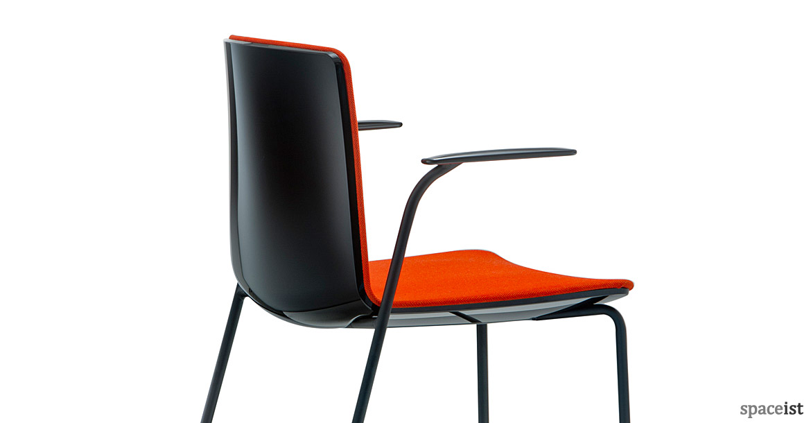 Noa chair glossy black back with a red seat