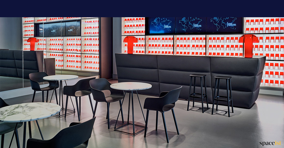 Black reception desk with stools