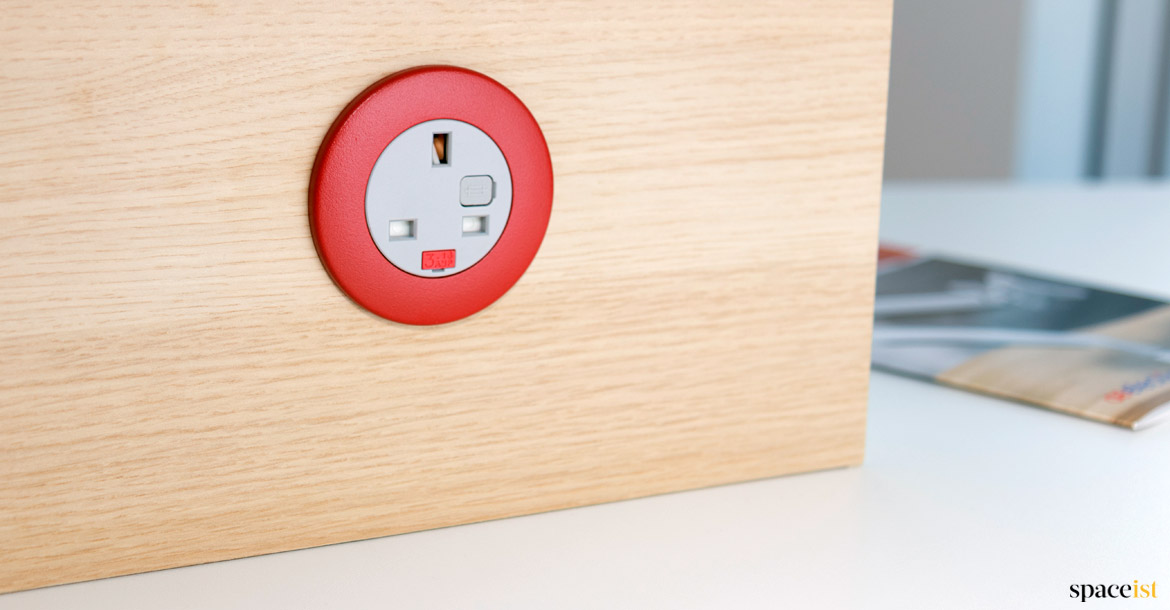 red plug socket in desk screen