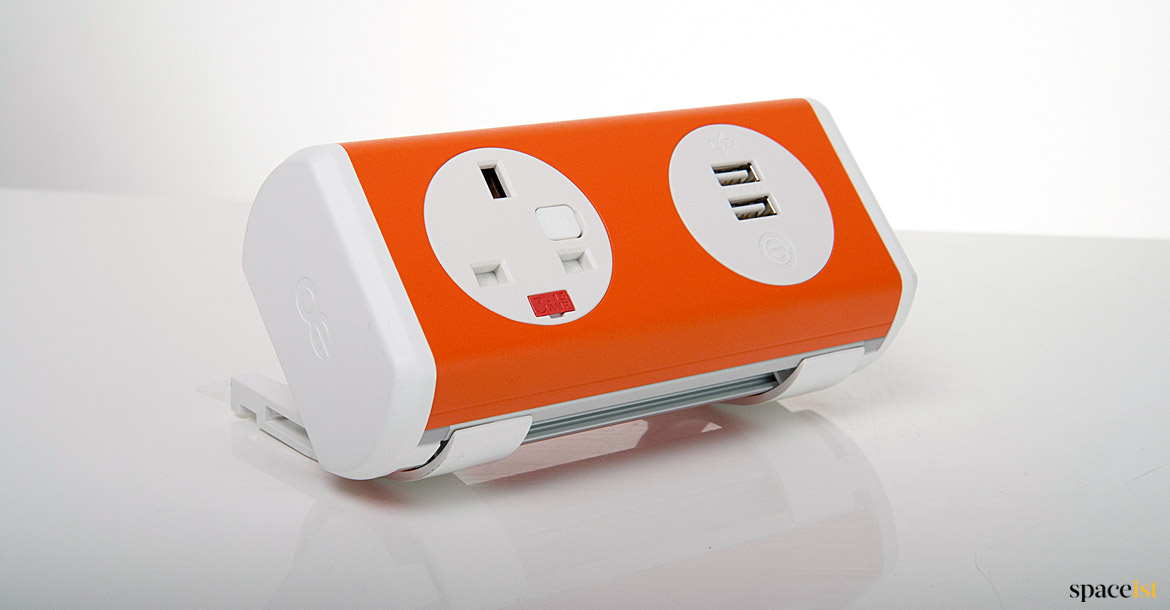 Orange + white UK plug socket for desk