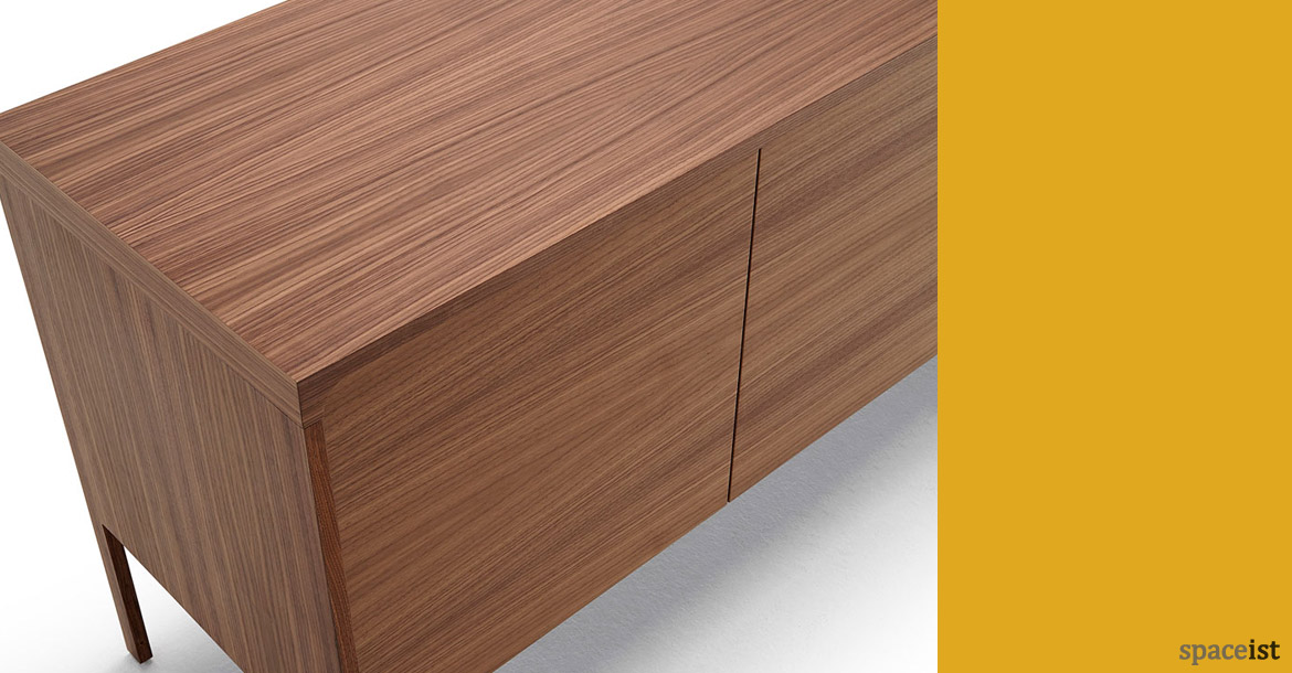 Tactile walnut meeting room cabinet close-up
