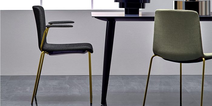 Weet meeting chair with a brass frame and dark grey seat