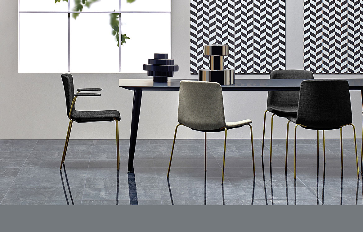 Weet meeting chair with a brass frame and dark grey seat