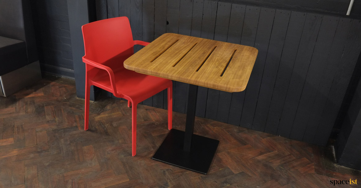 Wood top with red chair