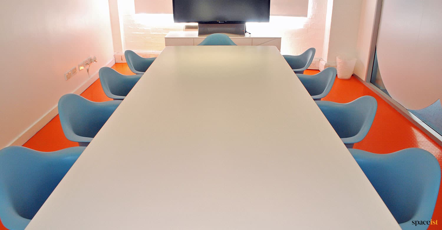 Long white meeting table eames chairs