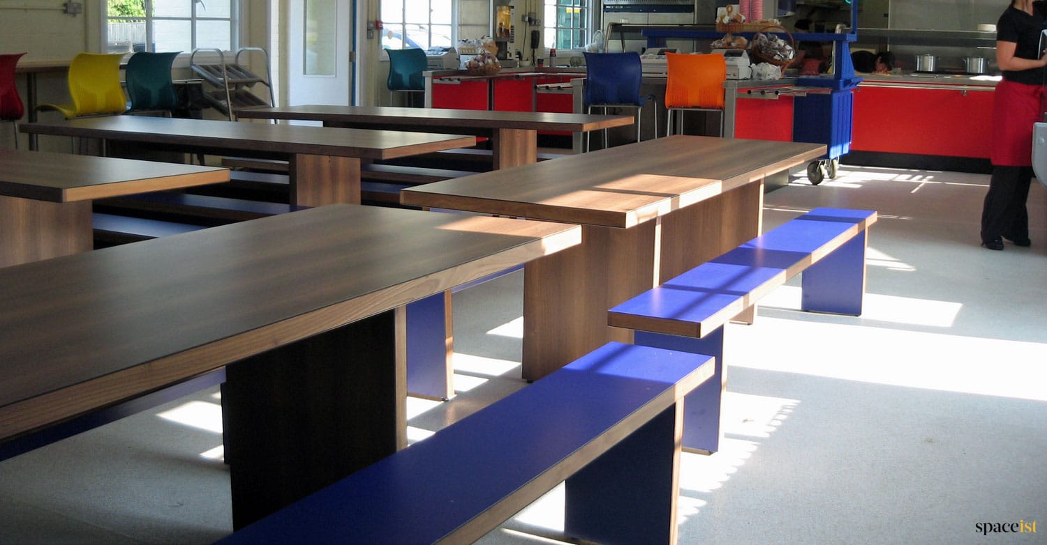 Blue + dark wood dining hall tables