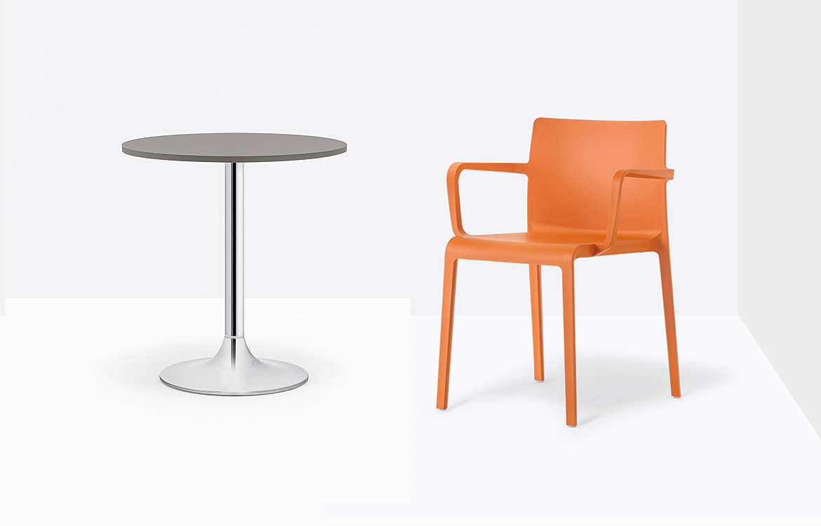 Small chrome cafe table with stacking orange chair
