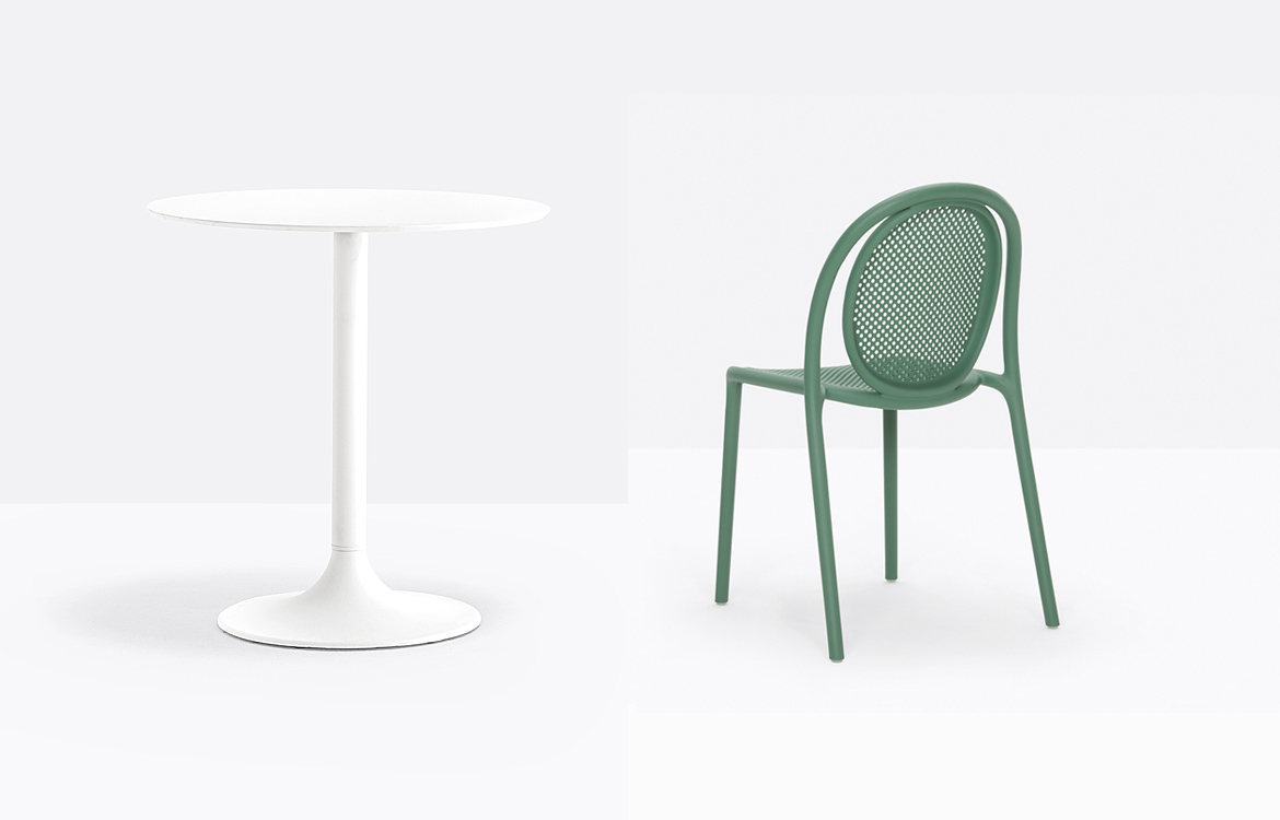 Trumpet styel cafe table with a green chair