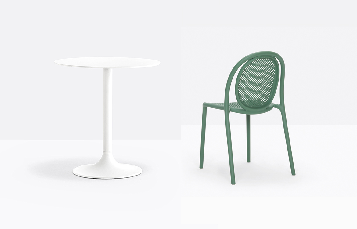 White cafe table with green chair