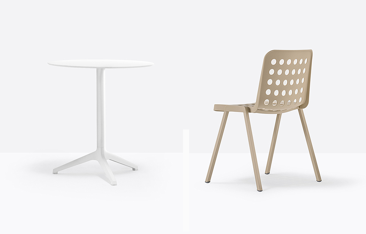 White outdoor cafe table with beige cafe chair
