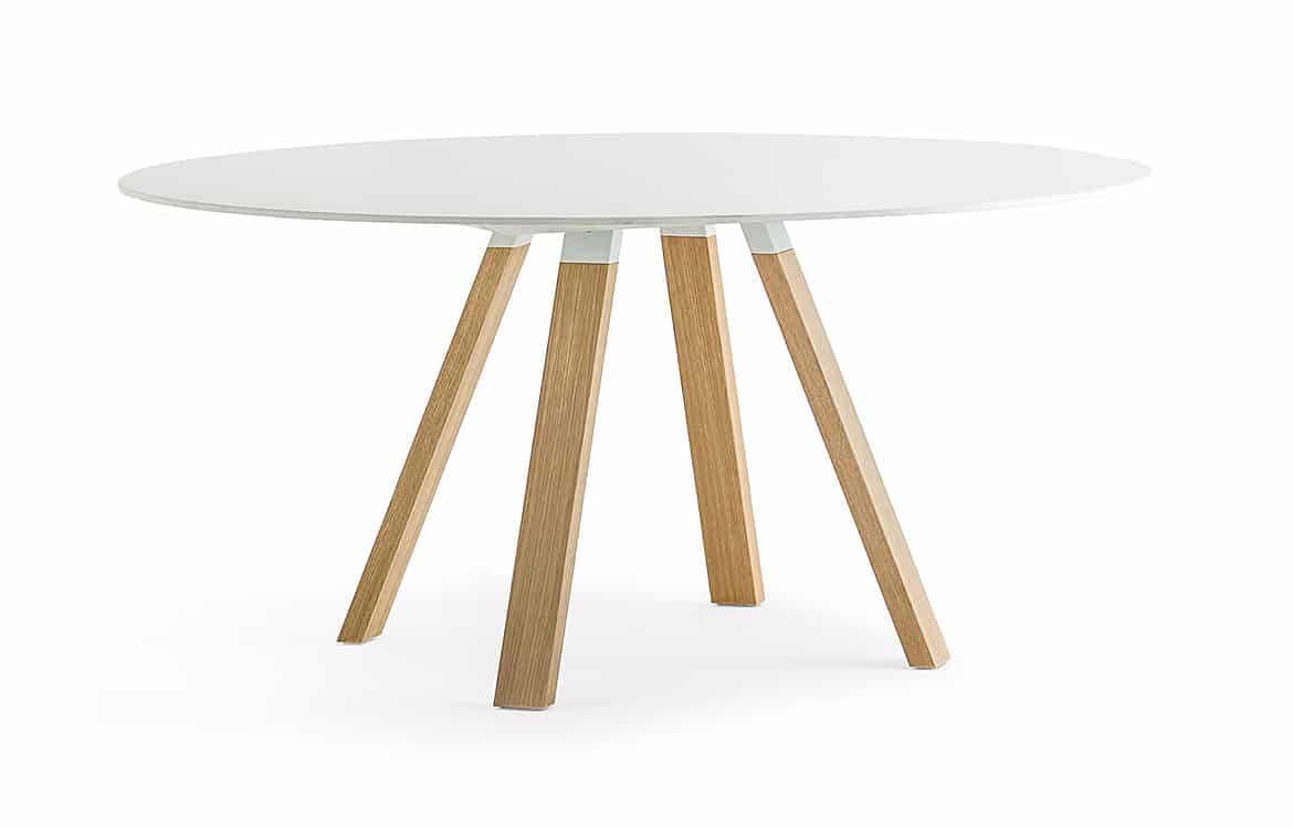 Round meeting table with oak legs