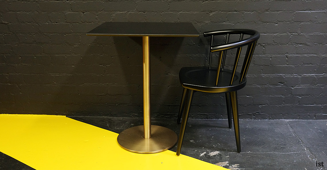 W black cafe chair with brass table