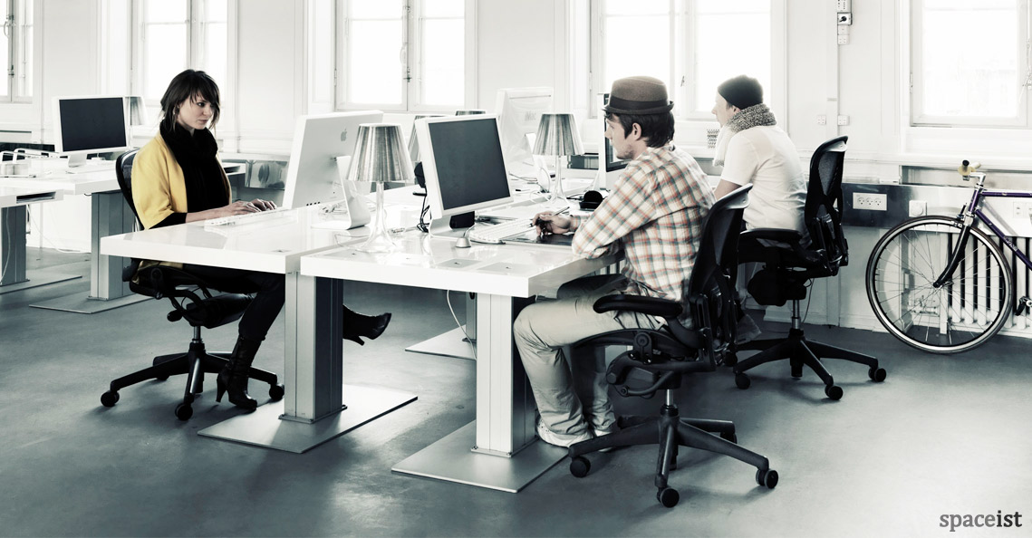Milk standing desk group of four people