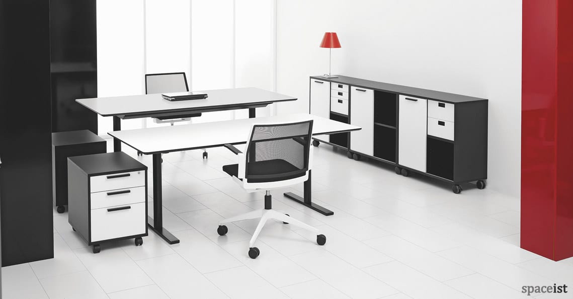 Q-10 standing office desk with a black leg and white top