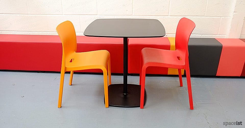 stylus black cafe table with orange pop chairs